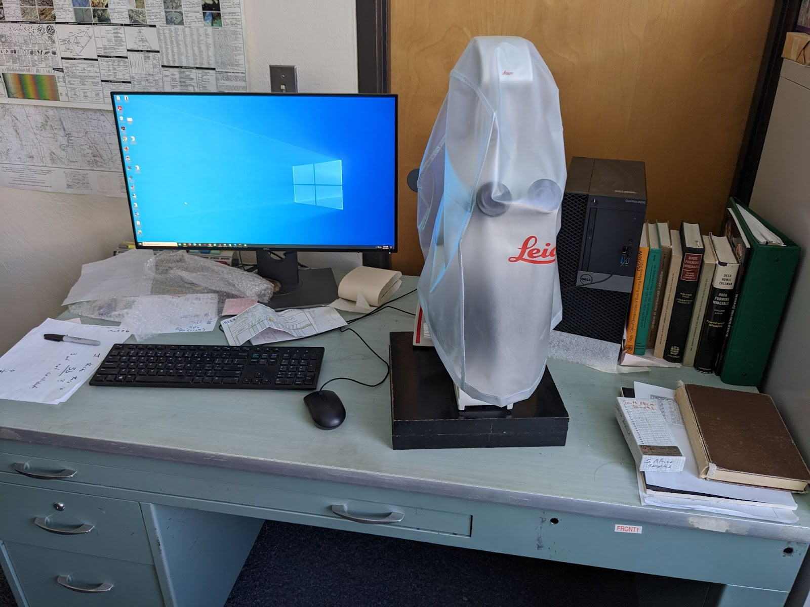 microscope and computer on desk