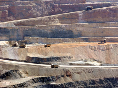 Haul trucks in an open-pit mine.